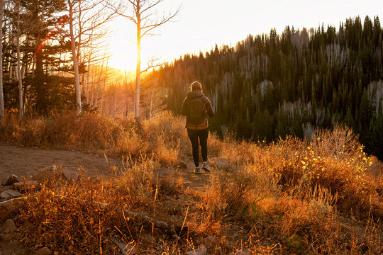 Hiker on a mountain trail on a beautiful autumn morning