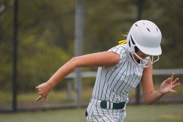 Softball player running the bases