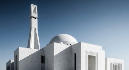 Striking modern religious structure features stark white facade against clear blue sky