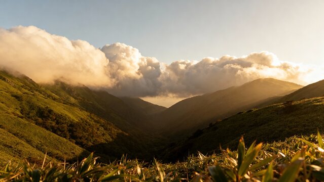 Wide mountain valley landscape featuring rolling green hills and dramatic clouds, ideal as a natural background for travel, adventure, and outdoor concepts.
