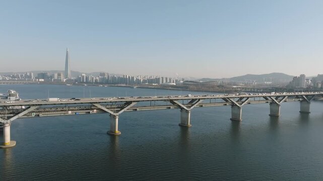 The view of Cheongdam Bridge in Seoul where subways and cars are passing by. 지하철과 자동차가 지나가는 서울 청담대교 풍경.