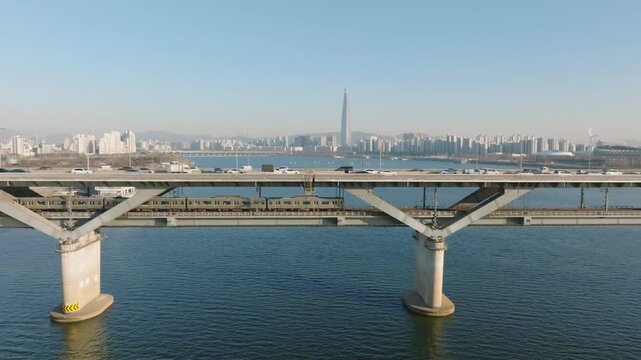 The view of Cheongdam Bridge in Seoul where subways and cars are passing by. 지하철과 자동차가 지나가는 서울 청담대교 풍경.