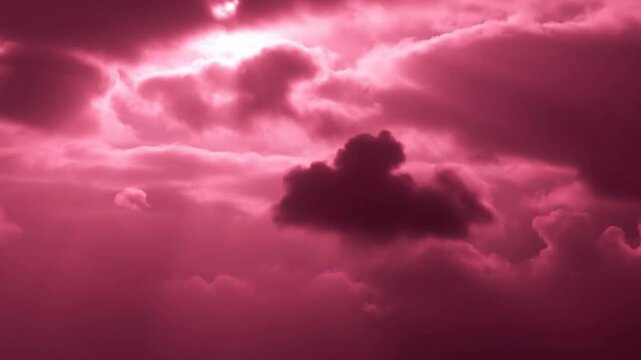 Dramatic pink clouds fill the sky, creating a surreal and intense atmosphere.