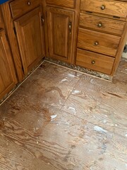 A plywood subfloor in a kitchen