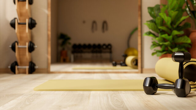 Black dumbbell and yellow yoga mat on wood floor across rack and mirror in fitness gym exercise room