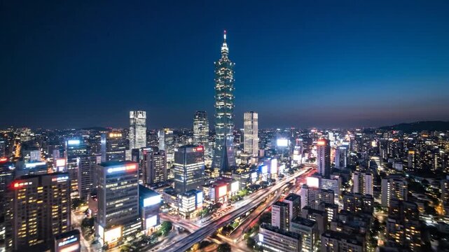A modern skyscraper dominates a glowing cityscape at twilight