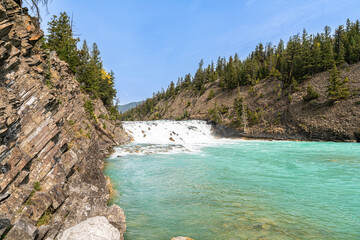 Fototapeta premium Bow Falls and Sedimentary Rock Strata in Banff National Park