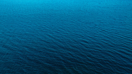 Top view of deep blue sea water surface with small ripples, aerial drone shot of turquoise ocean texture at island , abstract nature background  © Media 