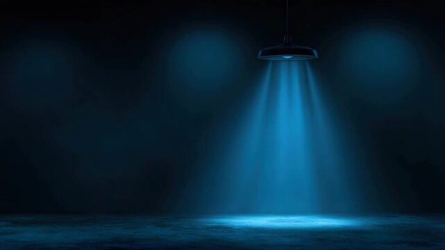 Blue spotlight beam illuminating empty stage floor with dramatic moody light and visible dust particles deep shadow cinematic focus and texture