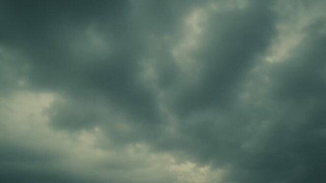 Overcast skies presenting dense cloud formations, creating a moody atmosphere with diffused light and a somber aesthetic for backgrounds and weather concepts