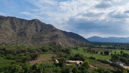 Obraz premium Aerial drone panoramic natural landscapes of Lambayeque, Peru, featuring forests, agricultural fields, and rural scenery near main cities and villages, ideal for tourism, marketing and graphic design