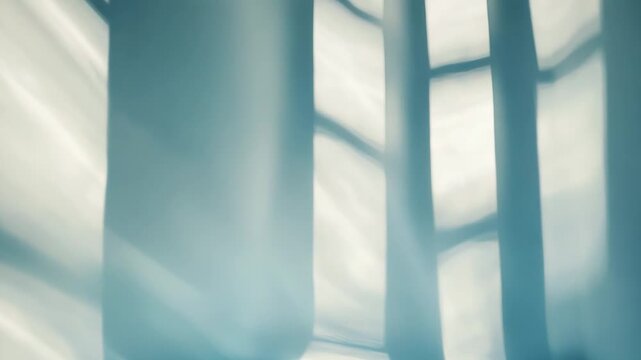 Abstract light and shadow patterns creating a tranquil and modern background, with bright reflections on the floor and soft light illuminating the minimalist wall
