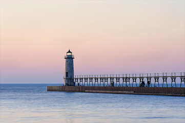 lighthouse on the pier in the evening