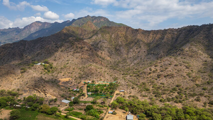 Aerial drone panoramic natural landscapes of Lambayeque, Peru, featuring forests, agricultural fields, and rural scenery near main cities and villages, ideal for tourism, marketing and graphic design