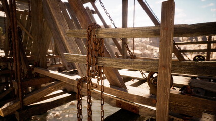 weathered chain hanging from timber scaffold, sunlightlit scene of rusted links, beams and hoist hardware in arid canyon setting with gritty texture suggesting