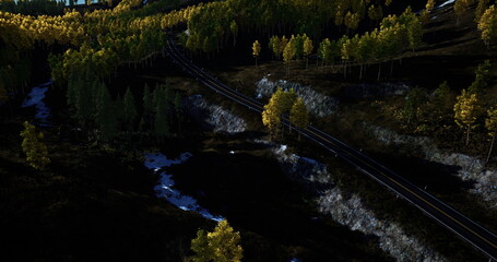 Autumn valley with river and shadows, Seasonal forest valley featuring tracks and reflections, Evening autumn landscape showing dark pond and shadowy trees