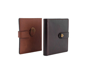 Two leather-bound journals with clasps, one light brown, one dark