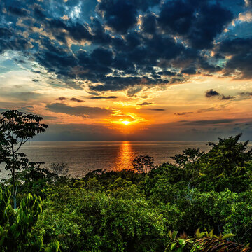 Sunset over the ocean and tropial forest in Costa Rica