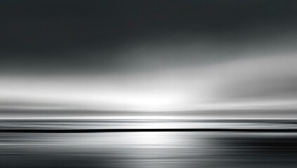 Abstract grayscale horizon with light reflecting on water