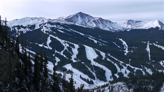 Center Village ski trail runs halfpipe Copper Mountain Ski Resort Ten Mile Peak Canyon mountainside i70 winter cloudy morning aerial drone December Wheeler Junction East Village cars parking circle