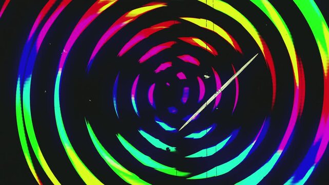 Psychedelic spinning clock, with moving hands and roman numerals. Hypnotic swirl colorful background. Edited with film damage.