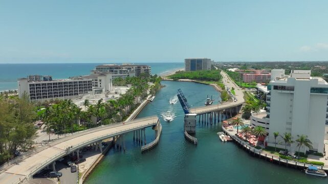 aerial drone view of Boca Raton Inlet, Florida with city and bridge