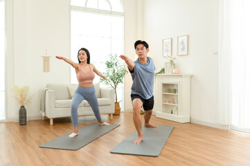 Obraz premium Yoga Practice Session at Home With Two Individuals Engaging in Workout Activities