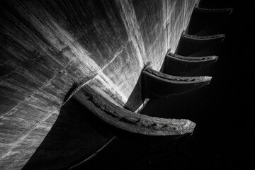 Stark black and white low-angle view of curving, layered structures