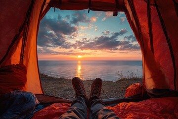 View from inside tent at sunrise over the ocean