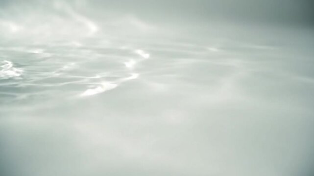 Gentle Caustic Projection Wide shot showcasing the atmospheric effect of slow-moving caustic patterns filling a minimalist, empty room or space.