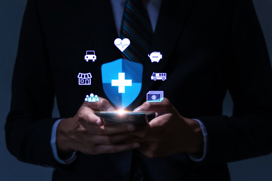business man working with mobile smart phone with virtual insurance icon diagram, real estate, property broker, insurance broker, accident insurance, business finance, health care technology concept