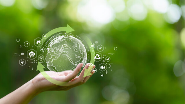hand holding digital earth with circular economy concept. renewable energy, resource efficiency, waste reduction, ESG strategy, SDGs, and sustainable environment green business innovation.