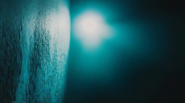 Empty concrete room corner with rough, gritty floor and wall textures, moody teal and blue lighting casting dramatic shadows for an eerie, industrial, abandoned backdrop