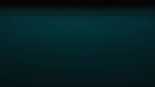 Water surface extending towards a soft gradient horizon line, where deep blue tones transition into a lighter, hazy overcast sky creating a sense of peace, openness and natural beauty