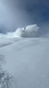 Snowboarder snowboarding first laps early morning cold smoke deep powder snow turning carving Copper Mountain Colorado white wave Ikon Pass top of American Eagle ski lift blue sky Vail Breckenridge