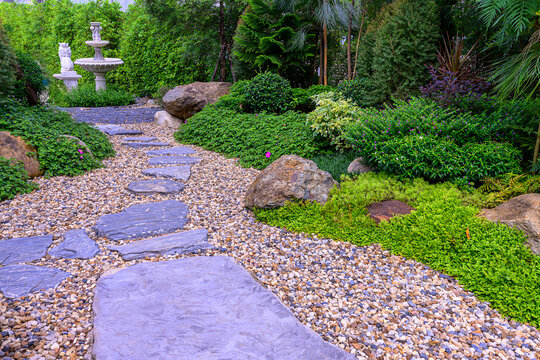 Stone stepping Walkway among lawn in a Japanese style garden.