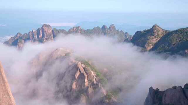 Real time delayed photography The mountain top is surrounded by clouds, and the famous scenery of Mount Huangshan in Asia and China，The scenery of Mount Huangshan in China is surrounded by clouds