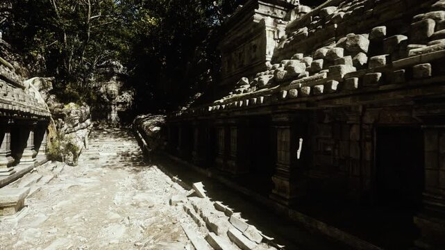 Sunlit jungle temple corridor ancient stone columns lining dusty path, crumbling carvings and moss clad walls, dappled canopy light creating deep shadows,