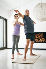 Elderly, man and stretching with physiotherapist for muscle flexibility, exercise or yoga in home....