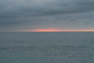 Fototapeta premium Calm sea under a cloudy sky at sunset.. Santander, Spain
