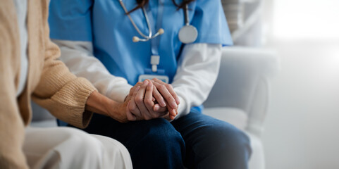 Obraz na płótnie Canvas Mental health and elderly care concept.Close up hands of helping hands elderly home care.Arthritis person's hand in support of geriatric doctor or nursing caregiver.Mother and daughter.