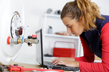 woman is reparing a boiler
