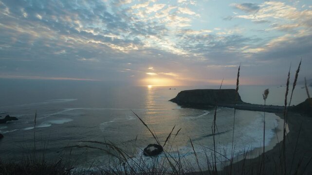 Sun sets over Goat Rock Beach on the rugged California coast
