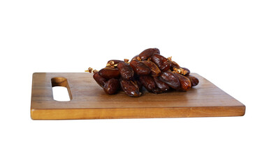 pile dates palm fruit on cutting board isolated