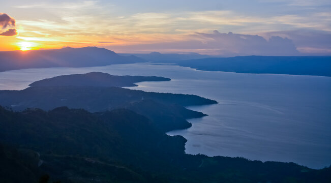 Beautiful view of sunset in the mountains, Huta Ginjang Geosite, North Sumatra, Indonesia