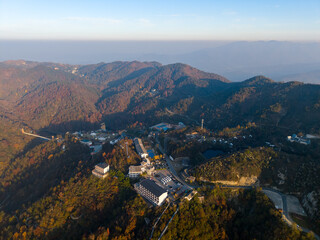 Naklejka premium Aerial view of mountain resort buildings and roads in Wuhan China during autumn