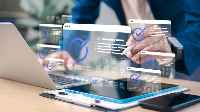 Business professional approving multiple digital documents with checkmark icons on virtual interface. Concept of workflow automation, approval process, compliance, and document management.
