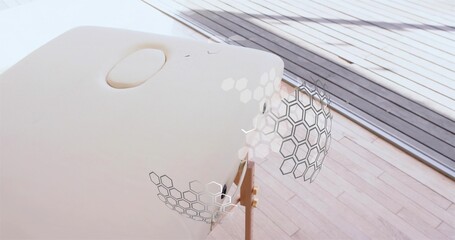 Naklejka premium Displaying white oval pod mounted on wooden tripod in modern interior, showing hexagonal panels