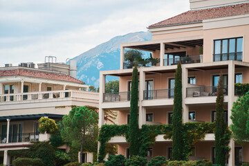 Fototapeta premium Modern apartment building with balconies and greenery