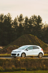 Fototapeta premium Car speeding along quiet countryside path